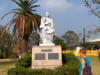 Photo of Kathy Lund and statue at Peace Park in Nagasaki Japan