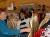 Christine helping Kathy shop for clothes at a silk market.
