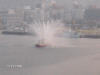 Picture of Fireboat in Japan spraying water out all over the place