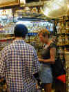 photos of kathy buying a chess set at a shop