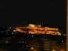 Nght picture of the Parthenon atop the Acroplis in Athens.  The Parthenon is all lit up