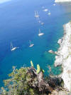 Southern side of Capri with yachts ancored in the beautiful blue water.