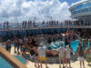 pictures of cruise ship passengers having fun in an activity around the pool