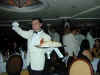 picture of cruise ship waiter serving baked Alaska